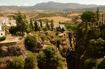 Fototapeta na wymiar Rhonda. Andalusia. Spain. Town on the rocks, white traditional houses over the cliff. Serrania de Ronda.