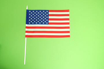 American flag on a green background.