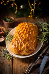 Perfect homemade juicy Beef Wellington, tenderloin dish on rustic wooden table
