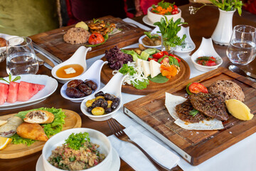 Eating red meat and appetizers in the restaurant