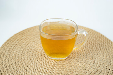 Transparent tea cup on a jute rope place mat