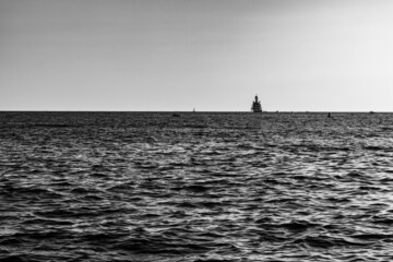 Naklejka na ściany i meble black and white , view of yacht in the sea 