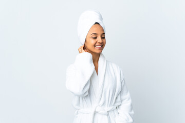 Young woman in bathrobe over isolated white background thinking an idea