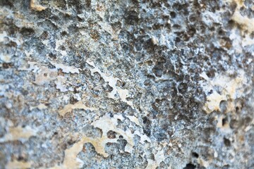 The aged shabby rock divided by cracks and layers, the texture of mountains