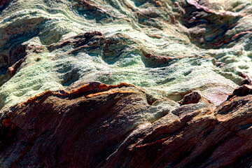 Colorful volcanic rock soil with abstract shape as texture background