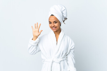 Young woman in bathrobe over isolated white background counting five with fingers