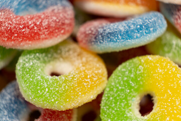 Fototapeta na wymiar Colorful sweet jelly and candies with sugar. Macro.
