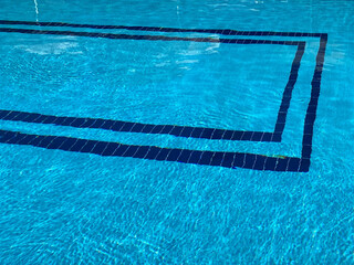 Small blue pool with ceramic tiles in a tropical resort hotel