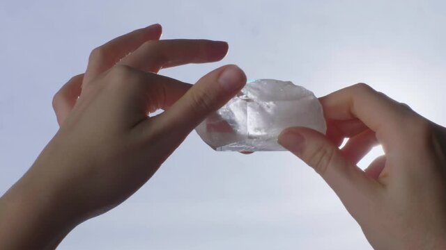 Crystal healing, woman hands holding magic crystal