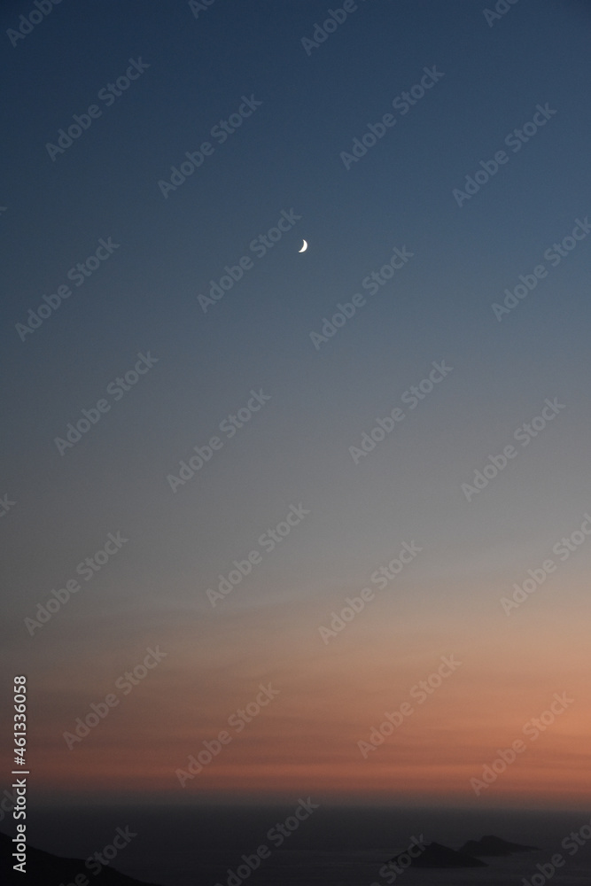 Poster Vertical shot of the dark blue sky where the crescent is visible