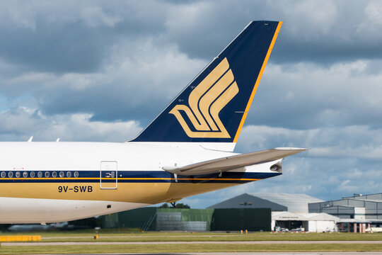 MANCHESTER, UNITED KINGDOM - JULY 18, 2015: Singapore Airlines Boeing 777 tail livery at Manchester Airport July 18 2015.