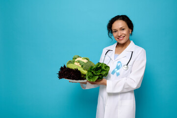 Beautiful mixed race woman nutritionist in medical gown and blue Diabetes awareness ribbon poses...