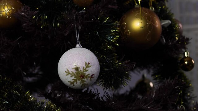Christmas balls toy  in luminous light with blurred background. New Year background or pattern.
