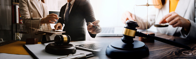 justice and law concept.Male judge in a courtroom on wooden table and Counselor or Male lawyer...