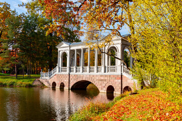 Marble bridge in autumn foliage in Catherine park, Pushkin (Tsarskoe Selo), Saint Petersburg, Russia