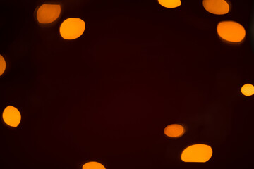 Abstract shimmering background with lights. Defocused golden bokeh lights. Valentine's Day, Christmas, New Year background.