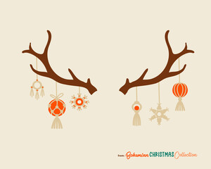 Christmas reindeer antlers decorated with boho chic hanhging decorations. Vector drawing isolared. Great symbol for cards and posters with vintage vibes.
