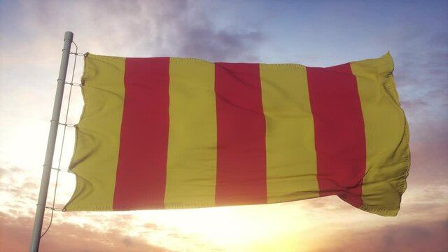County of Foix flag, France, waving in the wind, sky and sun background