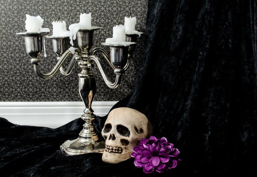 A Silver Candelabra And Skull In A Spooky Setting For Halloween
