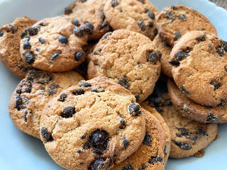 Background of oatmeal cookies with chocolate pieces. Oatmeal cookies close-up
