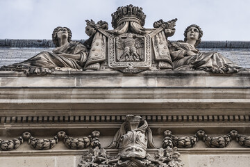 Architectural fragment of the facade of the military school (Ecole Militaire) founded in 1750 in Paris. Cavalry (Cavalerie) building. Paris, France.