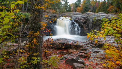 Scenic Dead river falls in Michigan upper peninsula during autumn time.