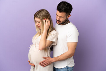 Young couple pregnant and in lateral position
