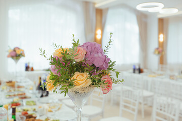 Fresh flowers in a bouquet on a festive wedding table decor