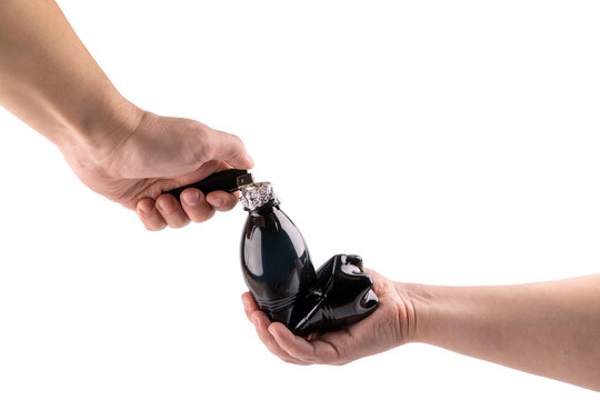 Two caucasian hand burns marijuana in bong from a plastic bottle and foil isolated on white background
