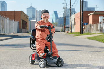 Portrait of male dwarf in the street in Texas looking into camera with tough attitude. 