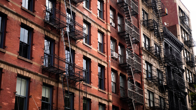 A patch of sunshine hitting an old red brick apartment building in SoHo, New York City. 