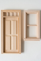 Obraz na płótnie Canvas miniature door and window on a paper background