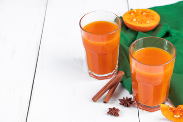 Pumpkin juice in glass on white background. Detox vegetable drink. Healthy vegan food. Diet concept.