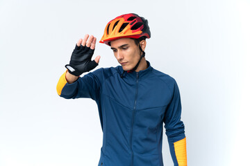 Young cyclist man isolated on background making stop gesture and disappointed