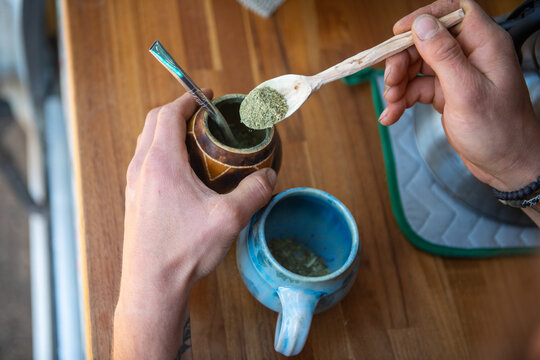 overhead shot of man making morning herbal tea.