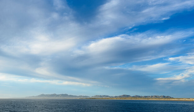 Blue skies over Isla Magdalena and Magdalena Bay at sunrise
