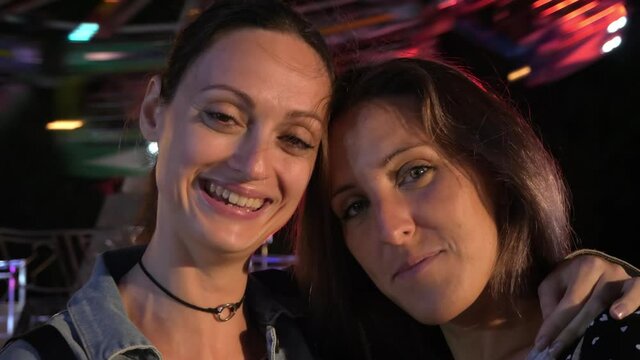 Young girlfriends on outdoor festival