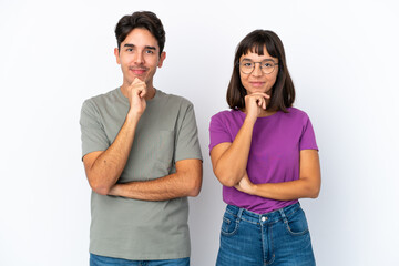 Naklejka premium Young couple isolated on isolated white background smiling and looking to the front with confident face