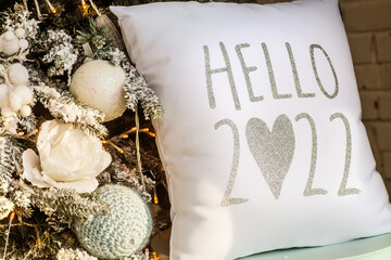 Pillow with inscription Hello 2022. New Year's background. Preparation for New Year.