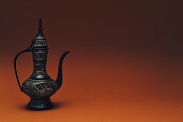 Vintage traditional islamic oriental engraved pitcher handmade on dark orange background. Elegant...