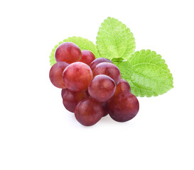 Ripe red grape. Pink bunch with leaves isolated on white. With clipping path. Full depth of field.