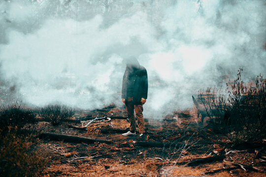 Strange Man Standing in Smokey Forest