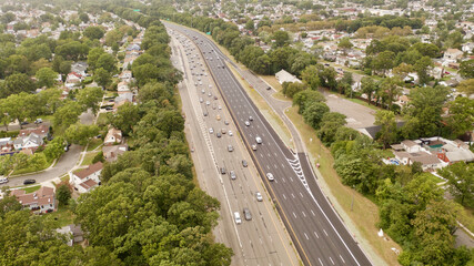 Long exposure shot taken with a drone over the Southern State Parkway on Long Island, New York, USA - obrazy, fototapety, plakaty