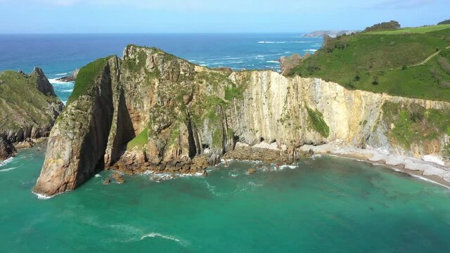 Bird's Eye View Of Rugged Limestone Cliff At Silence Beach (Playa del Silencio) In Asturias, Spain. - aerial