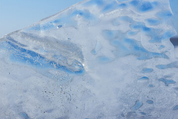 Fototapeta na wymiar frozen large block of ice with a blue tint. beautiful ice floe