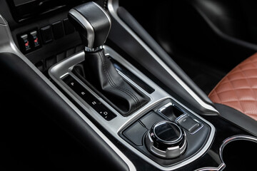 Fototapeta na wymiar Close-up view of the automatic gearbox lever. Interior car, automatic transmission gearshift stick