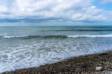 small storm on the sea, waves hitting the shore