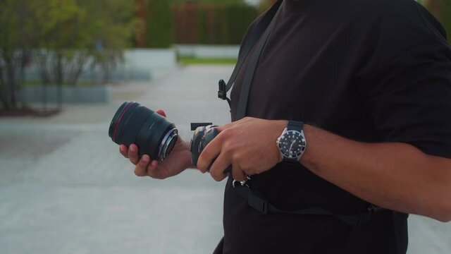 Man mounting lens to a camera, Checking camera sensor, Changing Camera lens