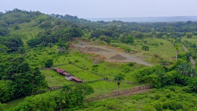 Open pit stone mine at Sabana de la Mar countryside, Dominican Republic. Aerial forward