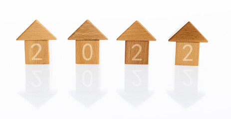 The wooden houses with number 2022 on white background